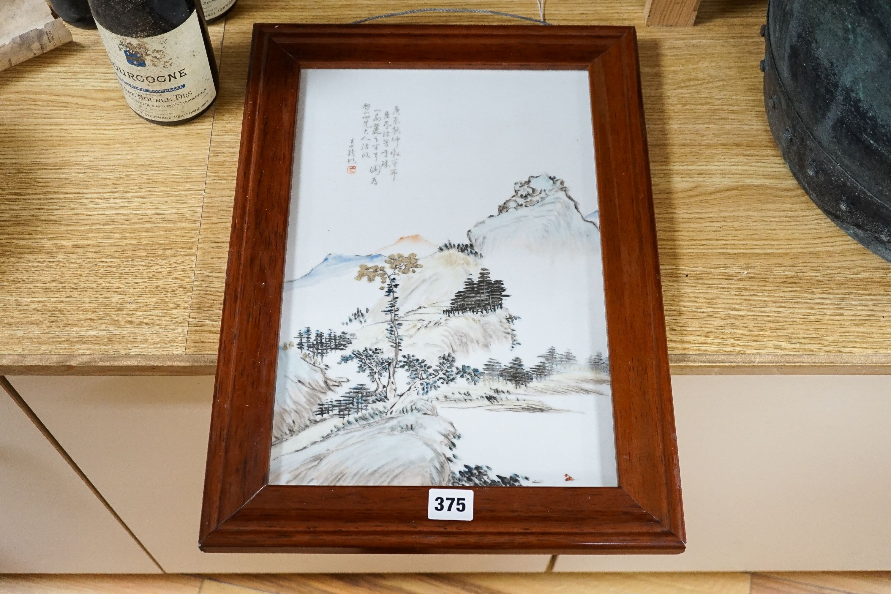 A Chinese porcelain plaque, landscape design with script, 37 x 25cm, in frame